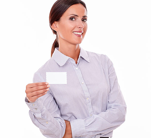 istock Smiling brunette businesswoman with visit card 537399038