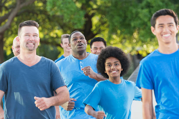 istock Multi-ethnic gorup of boys and men wearing blue shirts 537399446