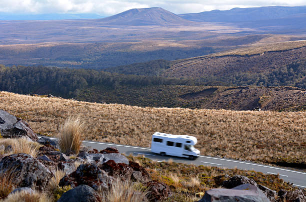 National Park, New Zealand - December 08, 2014: Campravan drive through Tongariro National Park. About 1M people visit the park every year, doing hiking and climbing in summer, and skiing and snowboarding in winter.