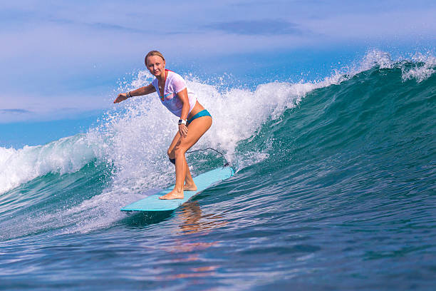 istock Surfer girl on Amazing Blue Wave 537400511