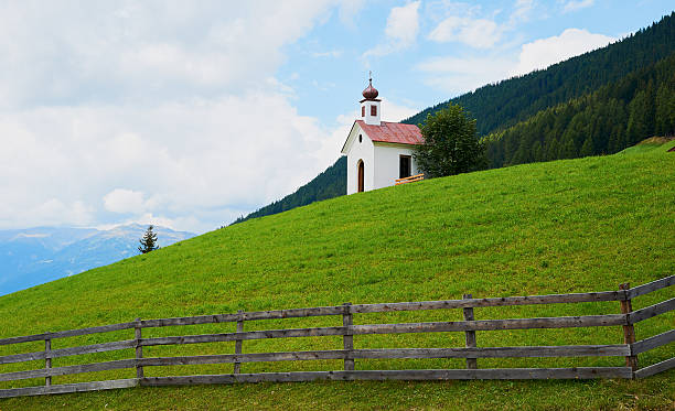 istock Austrian landscape with little church 537400574