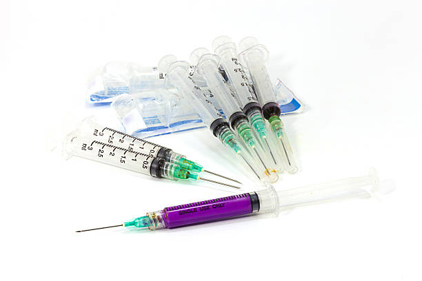 istock Dirty used syringe isolated on white background 537402767