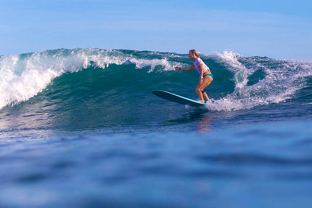 istock Surfer girl on Amazing Blue Wave 537403079