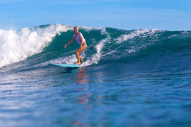istock Surfer girl on Amazing Blue Wave 537403081