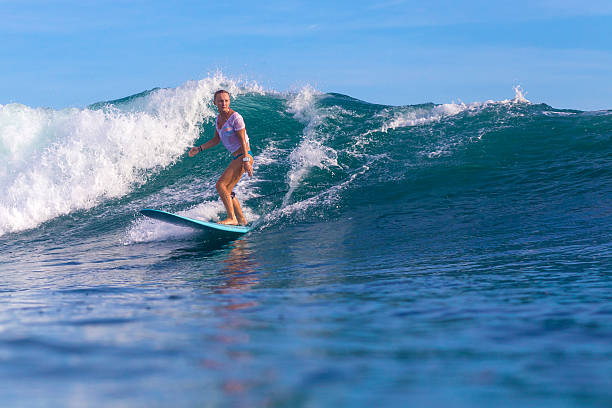 istock Surfer girl on Amazing Blue Wave 537403083