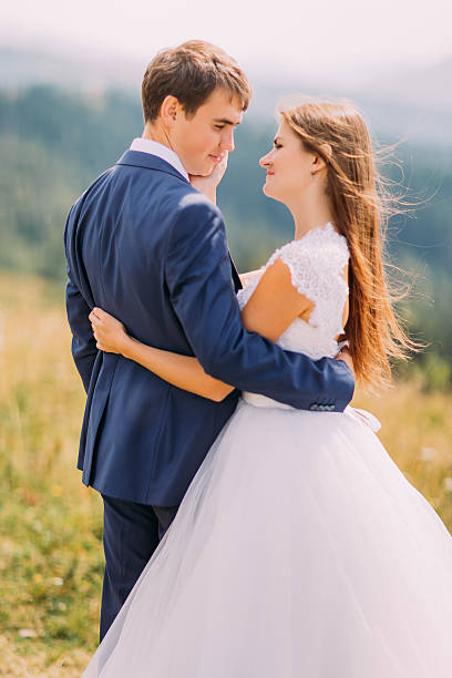 istock Close-up of beautiful stylish dressed pair holding each other 537403136