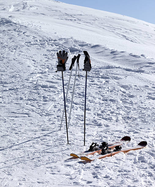 istock Skiing equipment on ski slope at sunny day 537403229