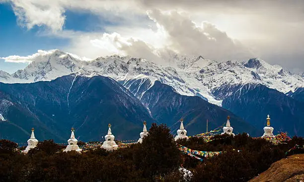 Meili(Meri) Snow Mountains. The photo is the some peaks in Meili Snow Mountains and some prayer banners Pagodas. Meili Snow Mountains is located in the northwest of Yunnan China.