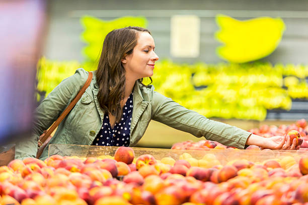 istock Grocery shopper picking out fresh fruit 537404380