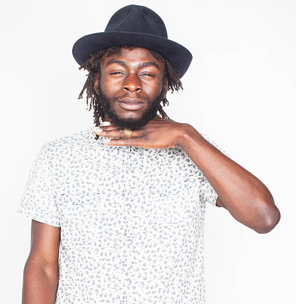 istock young handsome afro american boy in stylish hipster hat gesturing 537405074