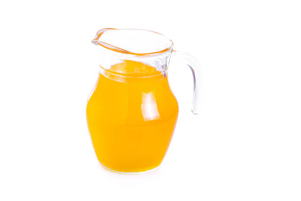 istock pitcher of orange juice isolated on white background 537405339