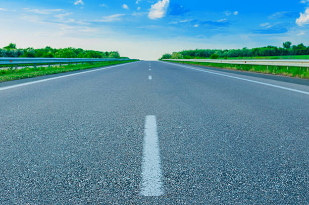 istock Nice country road with blue sky 537405628