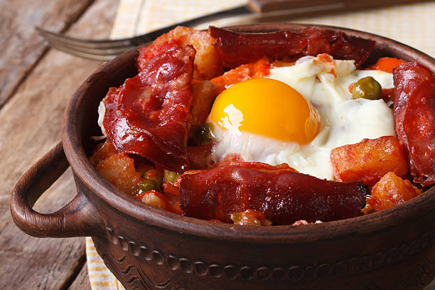 istock Baked eggs with chorizo and vegetables in the pot. Horizontal 537406283