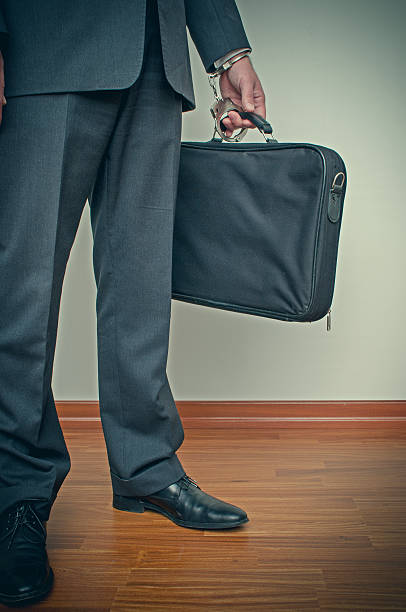 istock Businessman handcuffed to briefcase 537406619