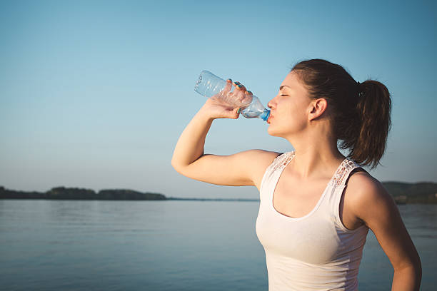 istock Fitness woman drinking water 537407052
