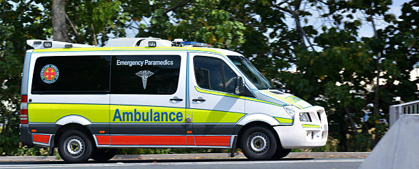 Australian Ambulance Gold Coast, Australia - November 07, 2014: An Australian Ambulance drives on the road in Gold Coast, Australia. queensland stock pictures, royalty-free photos & images