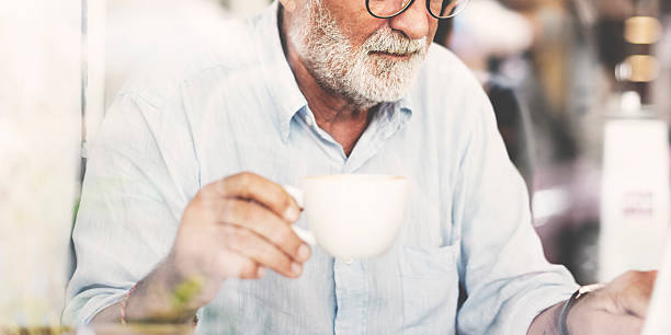 istock Senior Man Writing Working Coffee Shop Realxation Concept 537410692