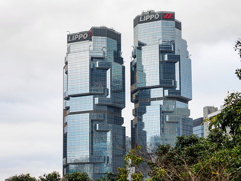 Hongkong, China- February 10, 2016: The Lippo Centre is a twin-tower skyscraper complex completed in 1988 at 89 Queensway, in Admiralty in Hong Kong.