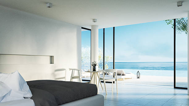 das moderne schlafzimmer-sonnenterrasse mit blick auf das meer - hotel room contemporary summer sea stock-fotos und bilder