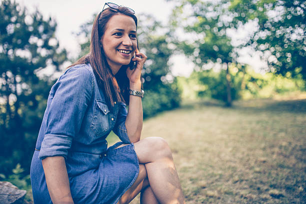 istock Girl on mobile in nature 537415200