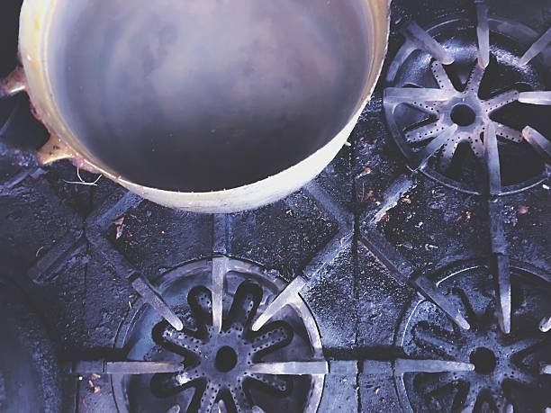 Big pot on the dirty stovetop background