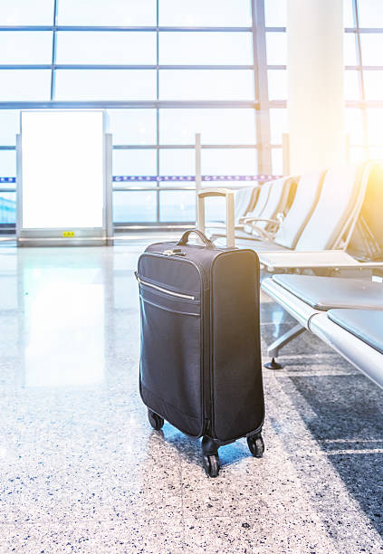 istock black suitcase standing in airport loppy 537418062