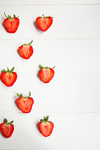 istock Strawberries on white wooden background with copyspace 537422810