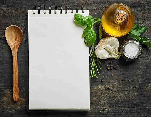 paper notebook and food ingredients, top view