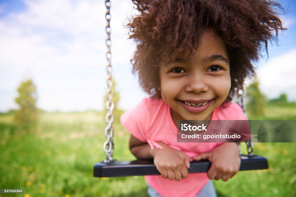 Little girl on the playground Child Stock Photo