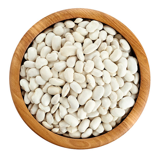 istock Wooden bowl with beans isolated on white background. 537431174