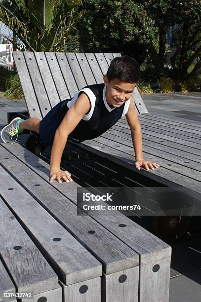 Boy Working Out In An Urban Park Stock Photo - Download Image Now - Active Lifestyle, Anaerobic Exercise, Auckland