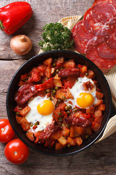 istock Baked eggs with chorizo and vegetables close up top view 537433203