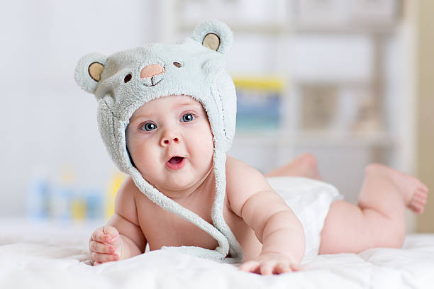 istock Five months baby girl weared in funny hat lying down 537433780