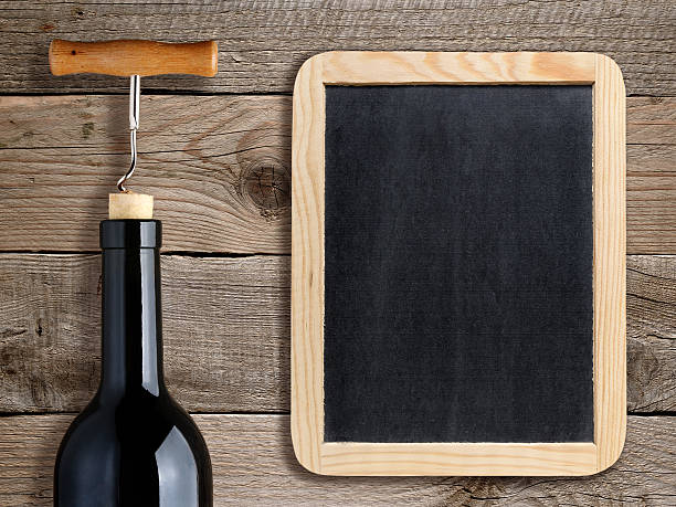 istock Bottle of wine and blank blackboard 537434769