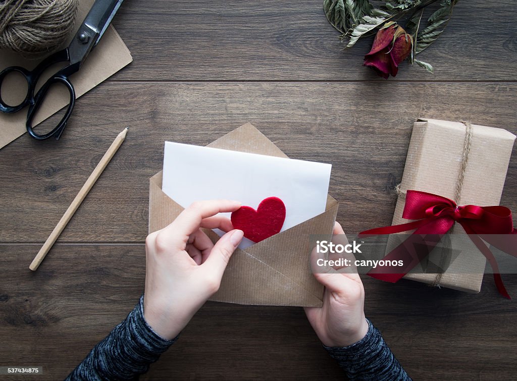 Sending love letter for Valentine’s day Female hands holding love letter 2015 Stock Photo