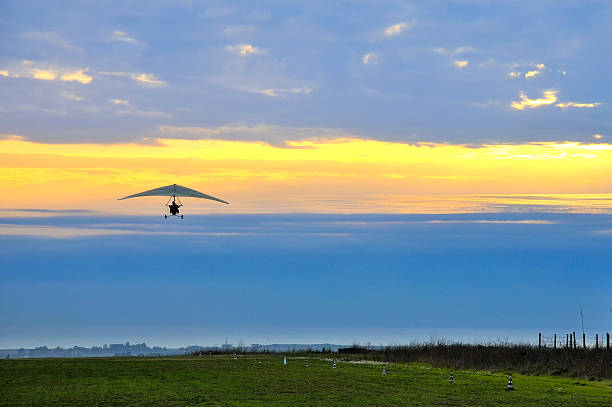 istock motor hang glider in the cloudy sunset 537435105