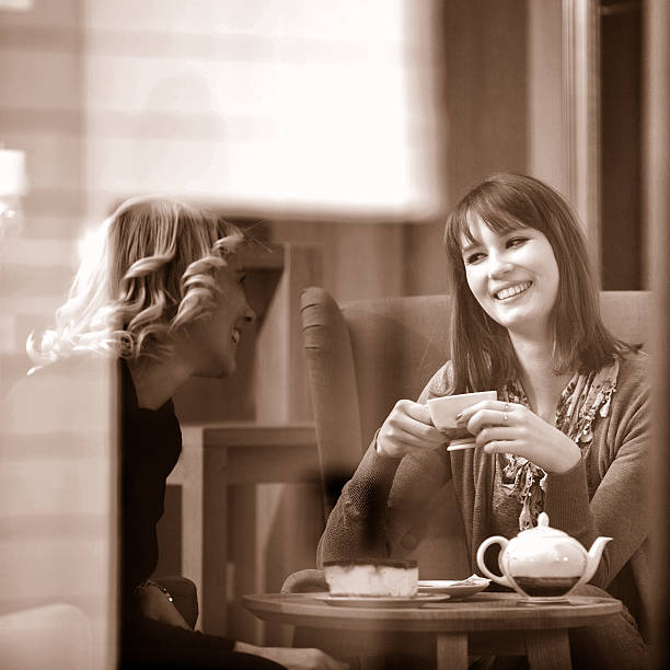 istock Two women enjoying cups of tea 537435803