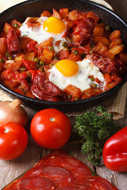 istock Fried eggs with chorizo  and the ingredients on the table. 537435825