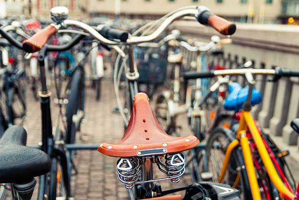 istock Vintage leather bike saddle with metal spring. Focus on bicycle 537435859