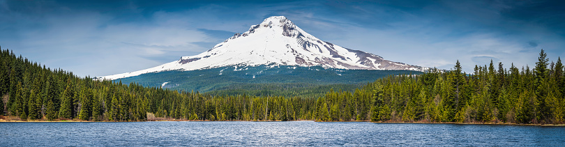 The iconic snow capped cone of Mt. Hood (3429m) rising out of the dense pine forests above the still waters of Trillium Lake, Oregon, USA. ProPhoto RGB profile for maximum color fidelity and gamut.