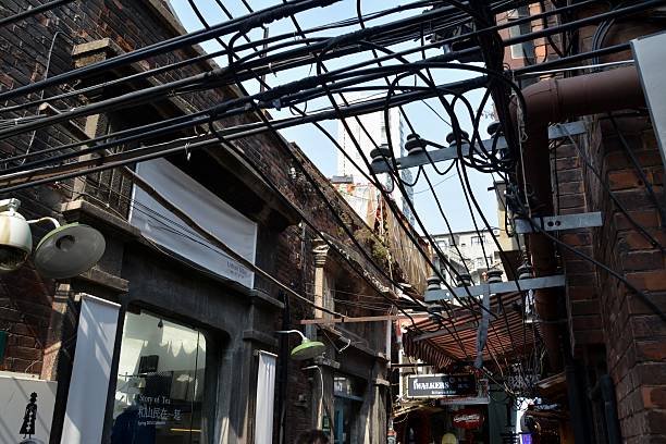 Shanghai, China - April 5, 2014: Tianzifang, architectural details, a popular arts and crafts enclave in the French Concession area of Shanghai. Tianzifang is known for small craft stores, coffee shops, art studios and narrow alleys. It has become a popular tourist destination in Shanghai