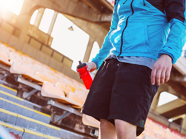 istock sportsman drinking water on the stadium 537438461