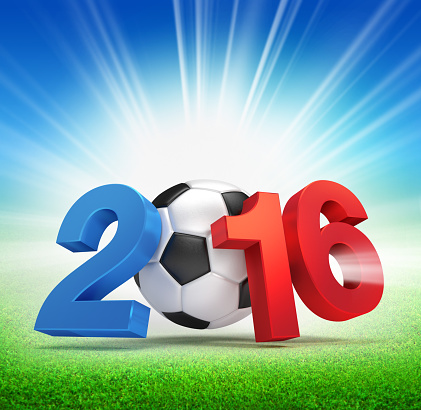 2016 year French flag colored, illustrated with a soccer ball and illuminated on a grass field