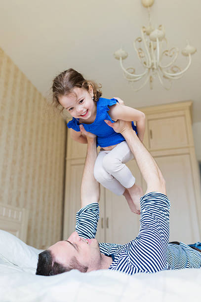 istock Father having fun with his cute little daughter 537438906