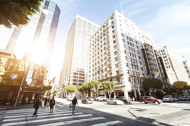 istock crowded people on road intersection in downtown of los angeles 537440250