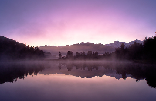 Mountain lake with reflection. Nature landscape. Lake Bohinj, Slovenia, Europe. Horizontal banner