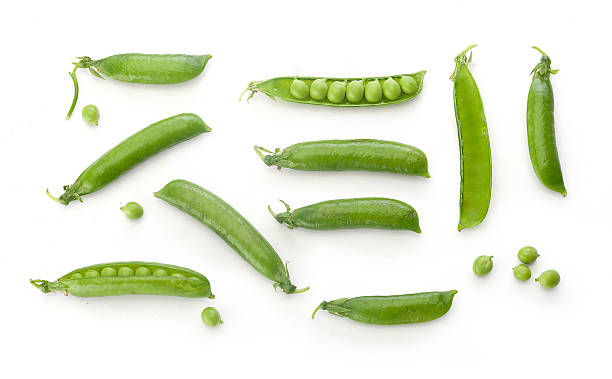 Fresh green pea pods and peas To view of fresh green pea pods and peas on the white background green pea photos stock pictures, royalty-free photos & images
