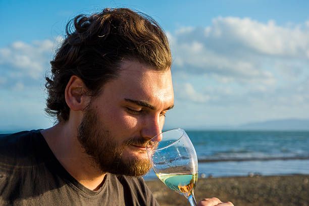 Men enjoying a glass of white wine