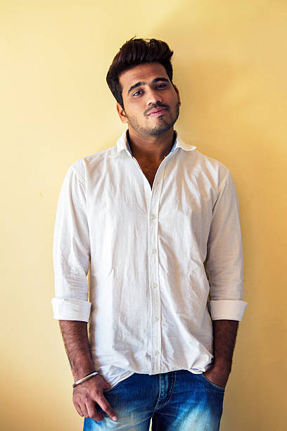 Young indian man standing in the door