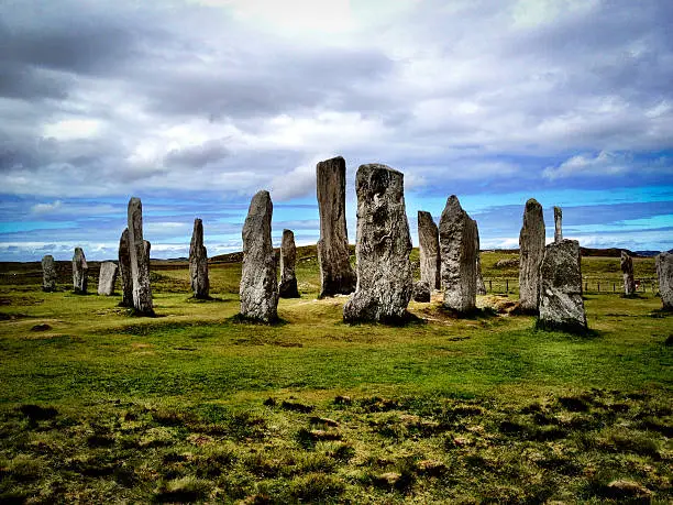 The ancient standing stone circle of Callanish (or Calanais), stand eerily tall on the West coast of the Island of Lewis in the Outer Hebrides of Scotland.  These stones were set up between 2900 and 2600 BC and were a hive of activity during the Bronze age.  The area is open to the public and can be accessed easily.  There is an unusual haunting feeling when there, that is hard to explain.